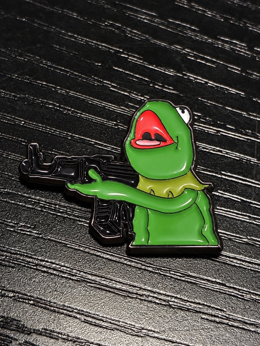 Green Frog Puppet Enamel Pin Holding Toy Rifle | Funny Meme Lapel Pin